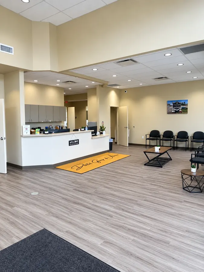 The lobby and front desk with the Dental Group of Aurora welcome rug